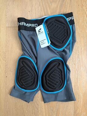 Champro Gray Compression football padded shorts with Blue Trim - youth medium